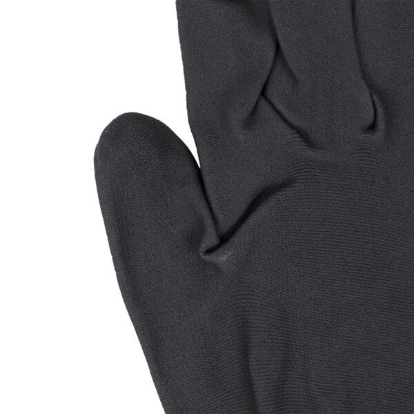 A close-up of a black Cordova Cor-Touch glove with a black foam palm coating.