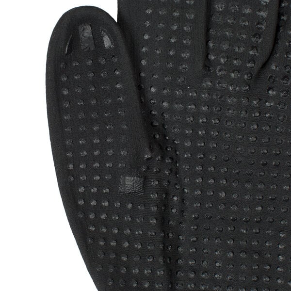 A pair of black Cordova Conquest warehouse gloves with nitrile dots on the fingers.