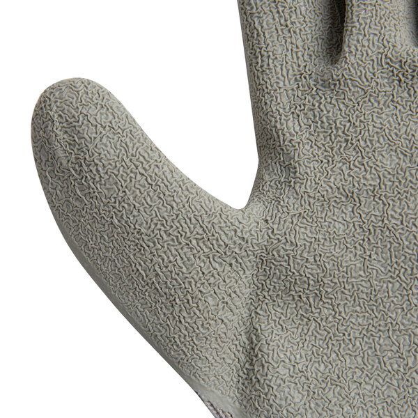 A close-up of a Cordova gray and white grip glove.