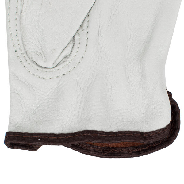 A white Cordova cowhide driver's glove with brown split leather backs.