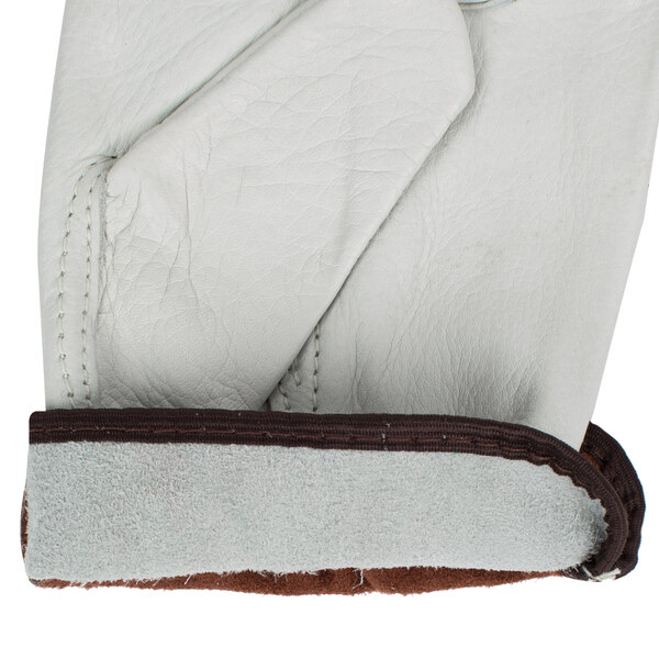 A pair of white leather Cordova driver's gloves with brown fabric on the back.