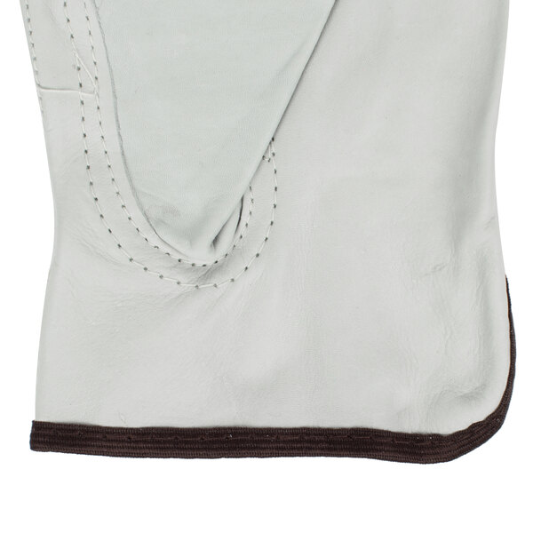 A white Cordova leather driver's glove with brown stitching.