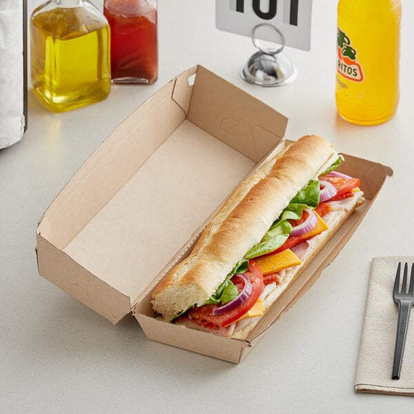 A sandwich in a Bagcraft Eco-Flute corrugated box on a table.