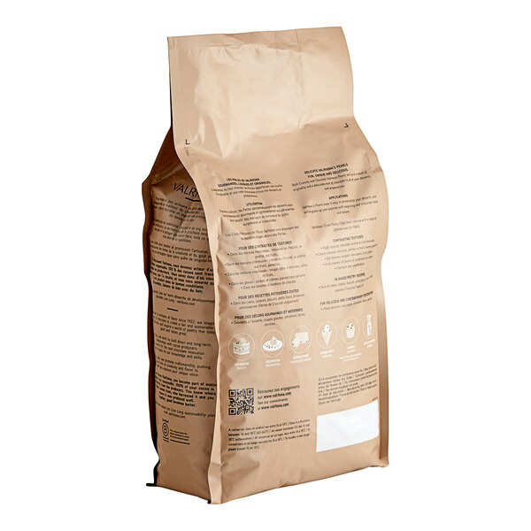 A brown bag of Valrhona Opalys white chocolate pearls with text on it.