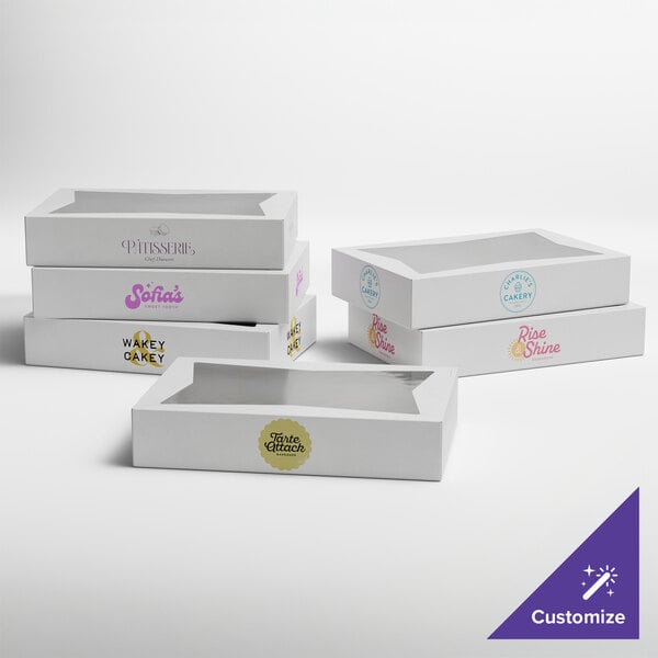 A set of white customizable bakery boxes with clear window lids, each featuring different printed logos.