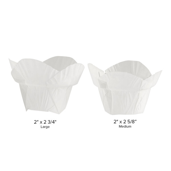 Two white Baker's Mark paper cupcake liners with measurements.
