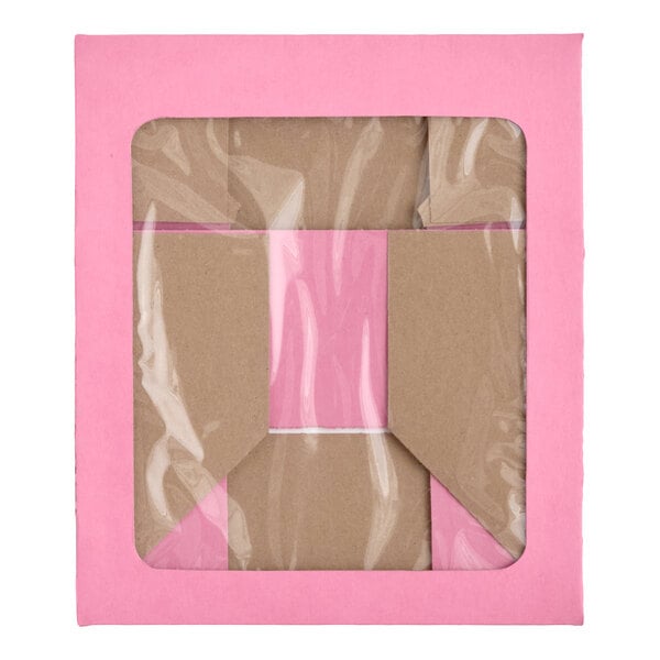 A pink rectangular box with a transparent window on the top, showing folded cardboard inside.