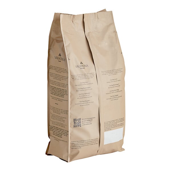 A close-up of a brown Valrhona Hukambi Milk Chocolate bag with black text.