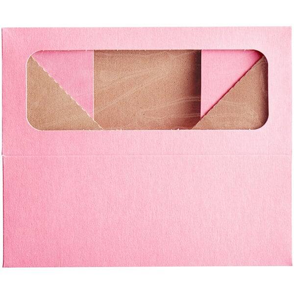 A pink Baker's Mark bakery box with a window.