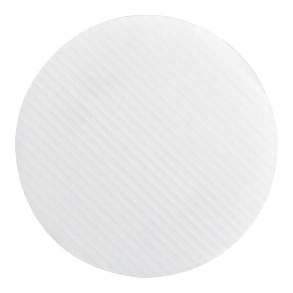 A round, white, corrugated grease-resistant cake circle.