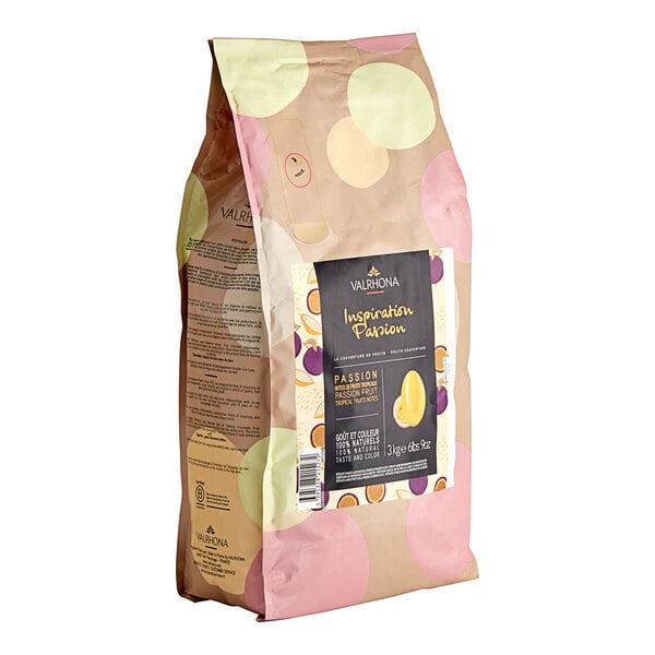 A package of Valrhona Passion Fruit Inspiration Couverture Feves with a yellow and pink polka dot pattern.