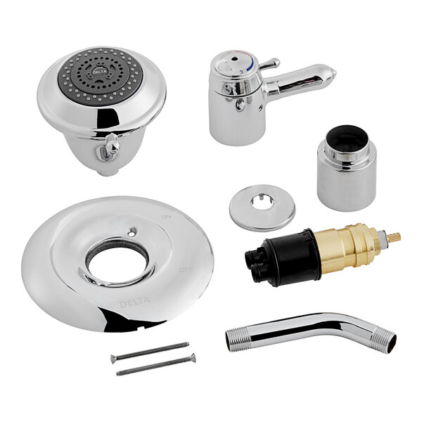 A group of chrome Delta shower faucets with accessories.