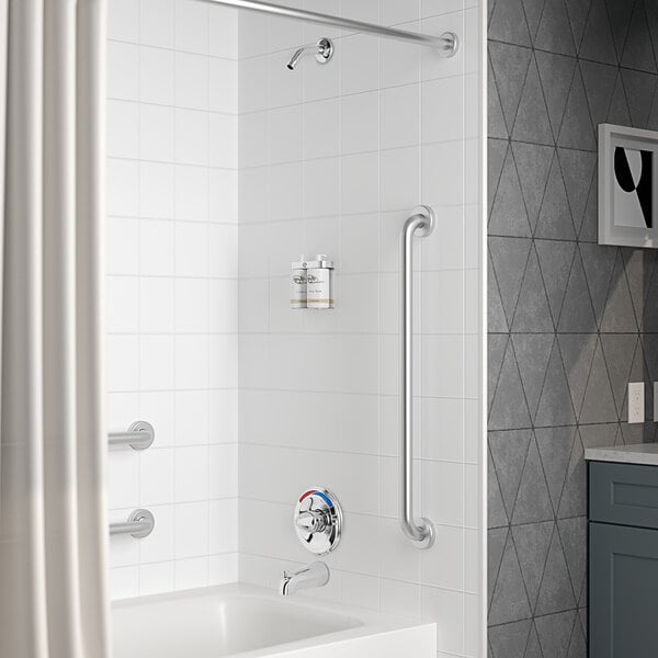 A white bathroom with a Delta shower and tub faucet.