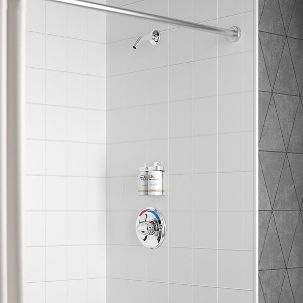 A Delta shower with a thermostat and a shower head.