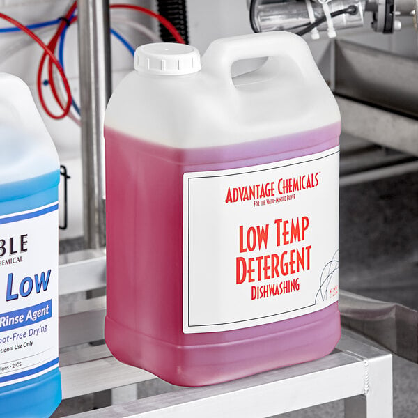 Two white jugs of Advantage Chemicals low temperature concentrated dishwashing machine detergent with labels on them.