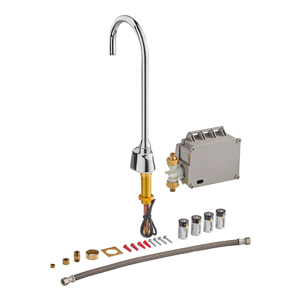 A Delta touchless kitchen faucet with a silver metal tube and other objects.