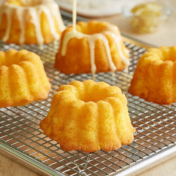 A cooling rack with New Day Mini Lemon Bundt Cakes.