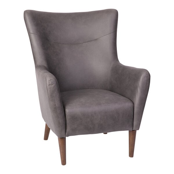A Flash Furniture Connor dark gray faux leather wingback accent chair with wooden legs.