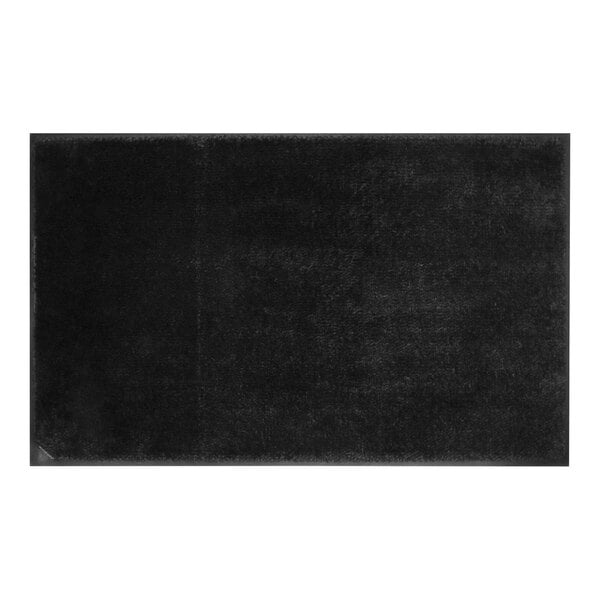 A black rectangular rug with a black rubber border and cleated backing.