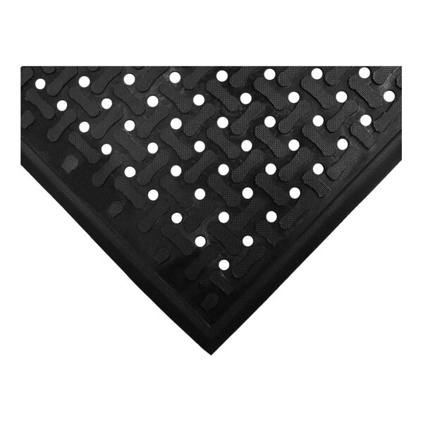A black rubber M+A Comfort Flow scraper mat with holes.