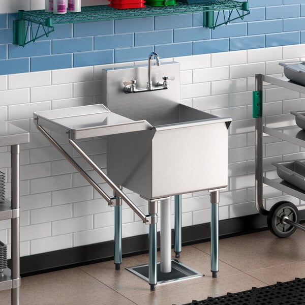 A Regency stainless steel 1 compartment sink with faucet and drainboard.