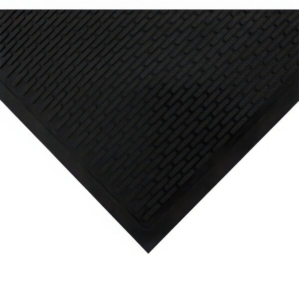 A close-up view of a black rubber mat with a textured, raised pattern and smooth edges.