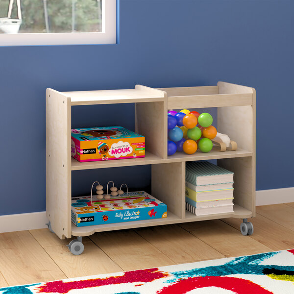 A Flash Furniture wooden mobile storage cart with clear bins on wheels filled with toys.