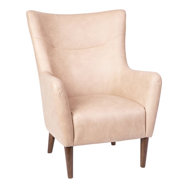 A light brown faux leather Flash Furniture wingback accent chair with wooden legs.