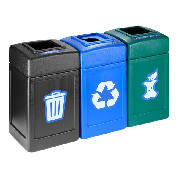 A row of black, blue, and green Commercial Zone Polytec recycling bins.