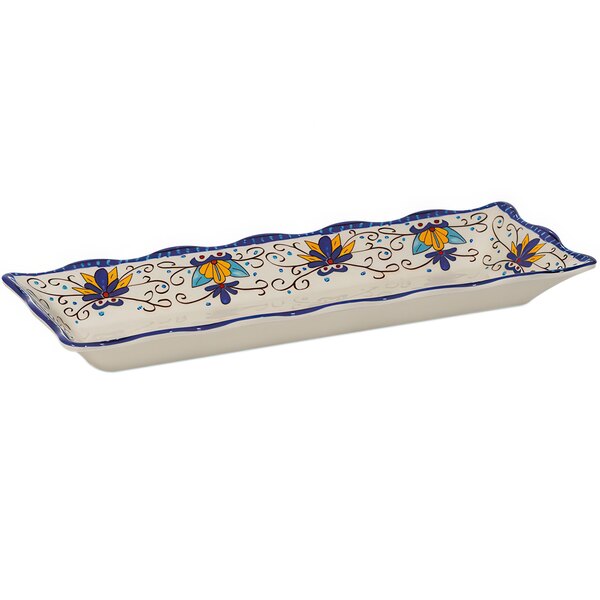 A rectangular white melamine display tray with a blue and yellow floral design.