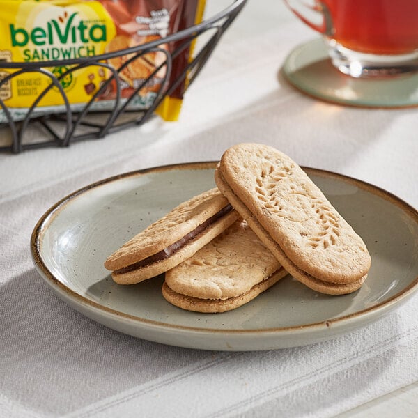 A white plate with two Nabisco belVita dark chocolate breakfast biscuits on it.