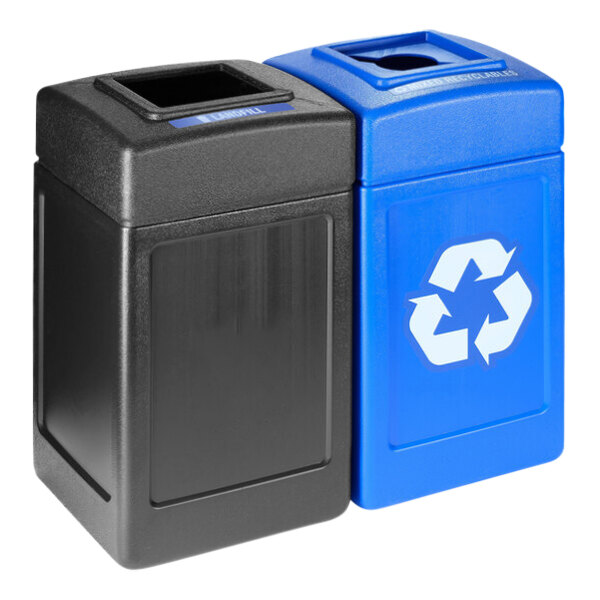 Two black and blue Commercial Zone recycling bins with open top lids, one with a blue lid.