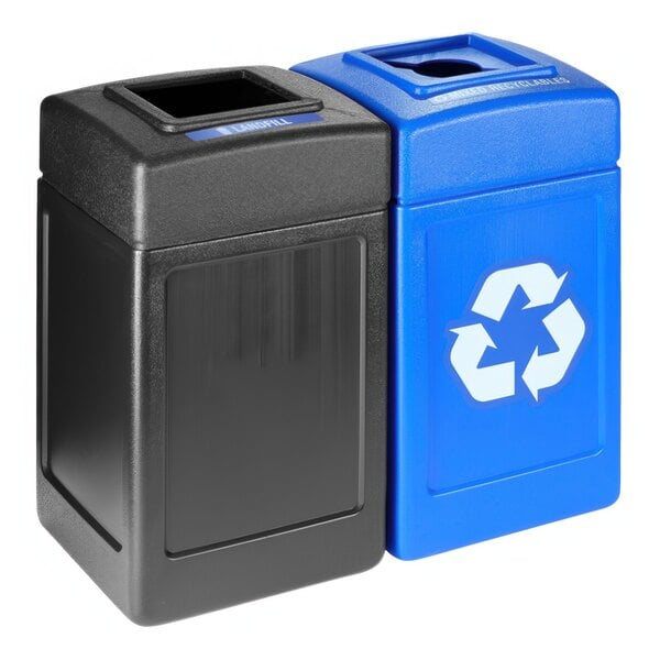 Two black and blue Commercial Zone Polytec recycling bins with open top lids.