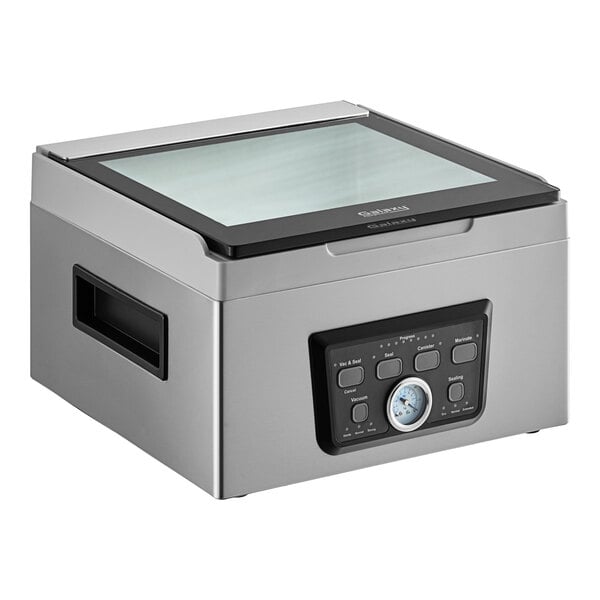 A rectangular metal box with a glass panel on the counter.