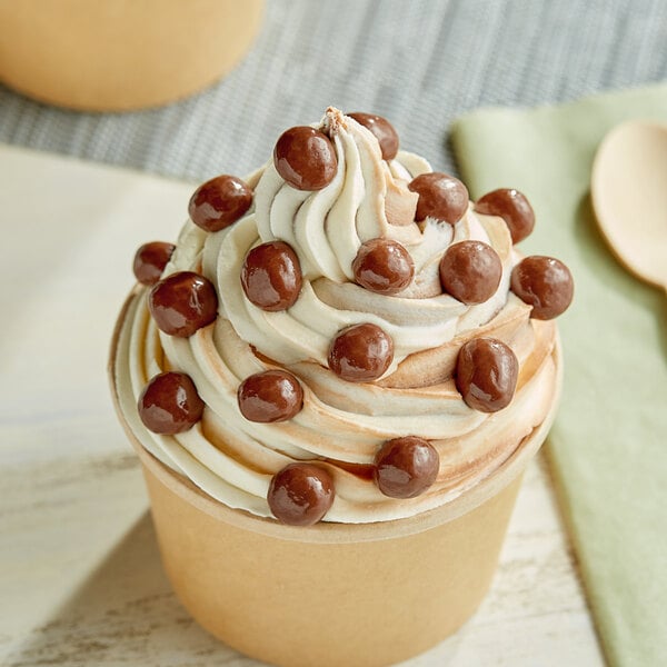 A cup of ice cream with Albanese milk chocolate brownie bites.