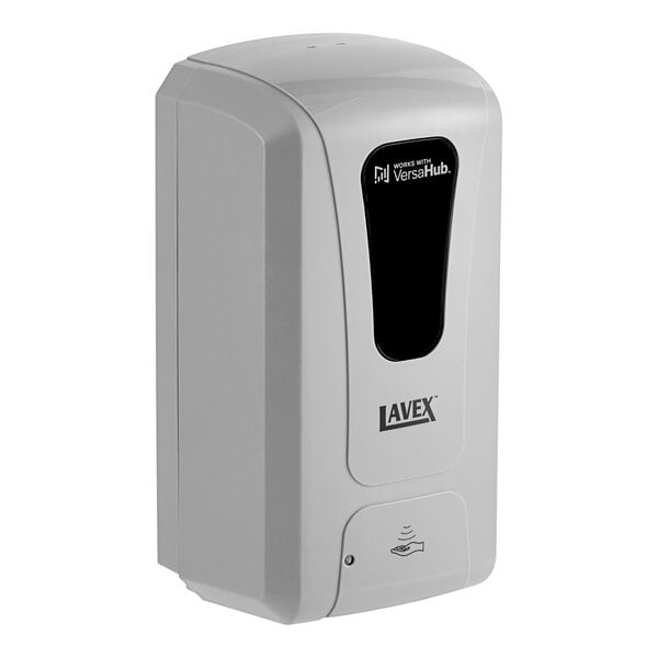 A gray rectangular soap dispenser with a black and white screen with the words "Lavex VersaHub"