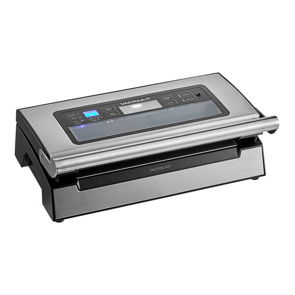 A silver and black Galaxy vacuum packaging machine with a roll holder and cutter.