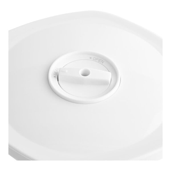 A white circular lid for a Galaxy VC2000 vacuum canister with a hole in it.