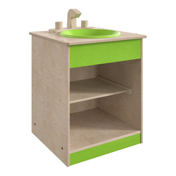 A green and white wooden children's play sink with a shelf.