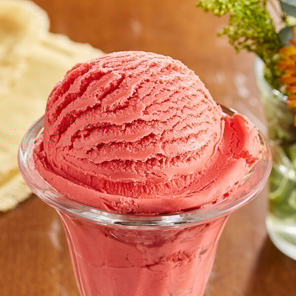A glass bowl with a scoop of pink I. Rice cotton candy ice cream.