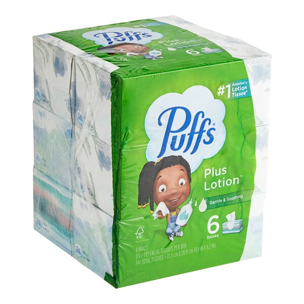 A white box of Puffs Plus Lotion facial tissues with 6 smaller boxes inside.