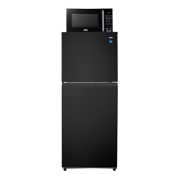 A black Summit Appliance refrigerator with a microwave on top.