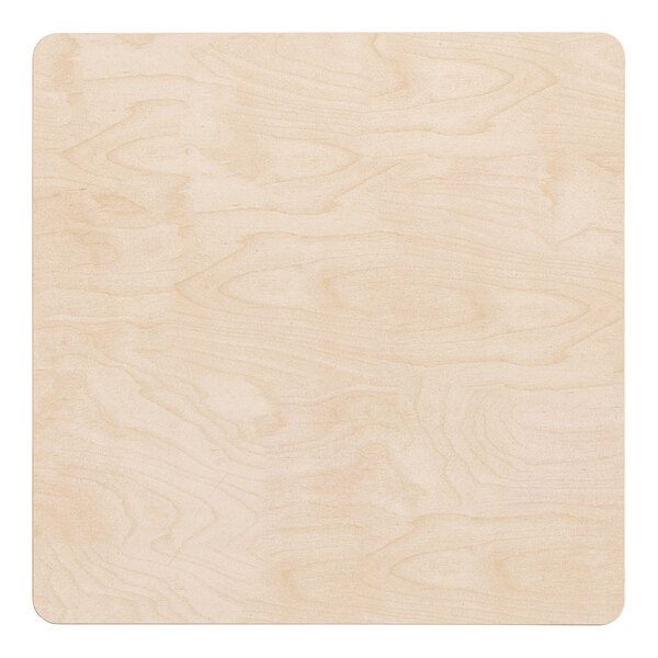 A close up of a wooden surface with a maze.