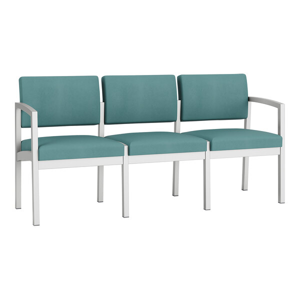 A Lesro Lenox steel sofa with teal fabric cushions.