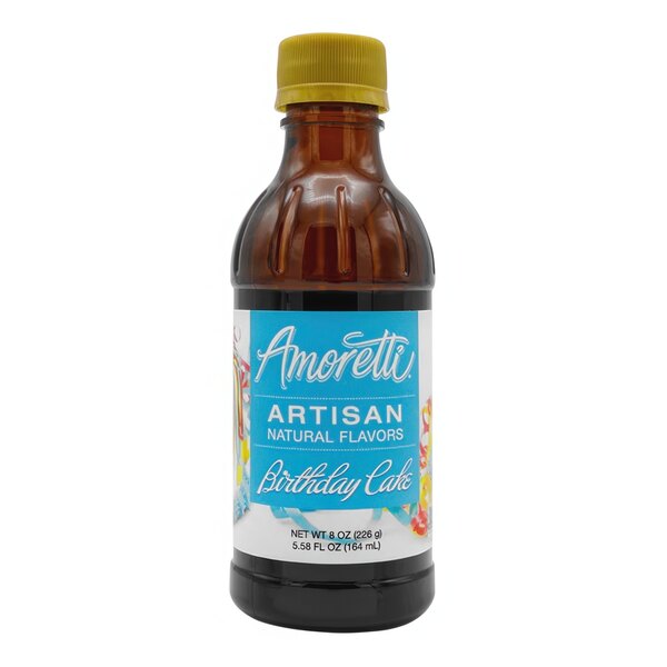 A bottle of Amoretti Birthday Cake artisan flavor paste with a blue label and yellow cap.