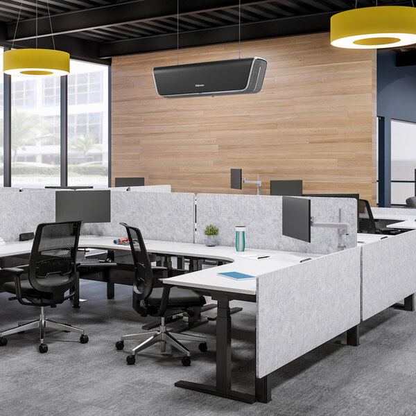 A black Fellowes Array Ceiling Air Purifier installed in an office space with cubicles and desks.