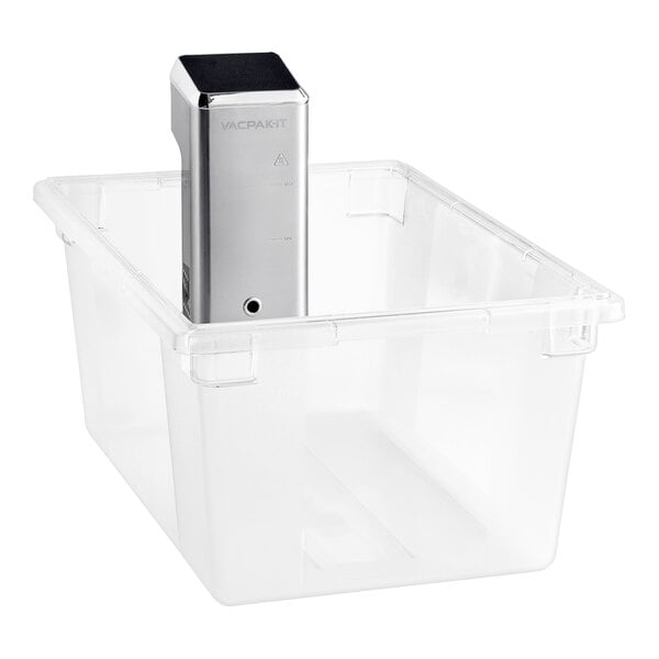 A clear plastic container with a silver VacPak-It sous vide immersion circulator head inside.