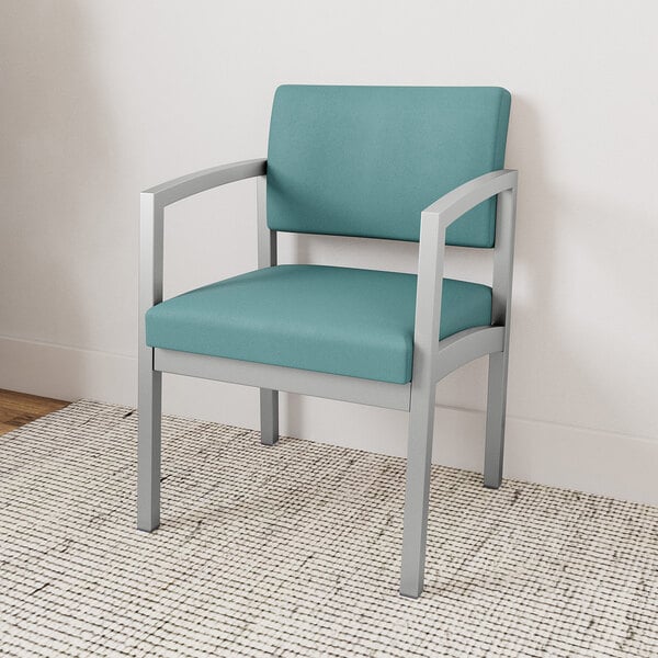 A blue Lesro Lenox guest chair with a silver frame against a white wall.