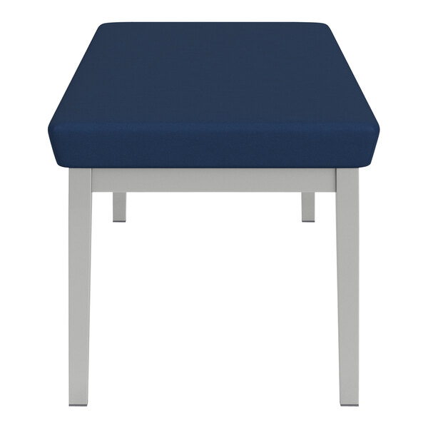 A Lesro Lenox steel bench with blue vinyl cushions.