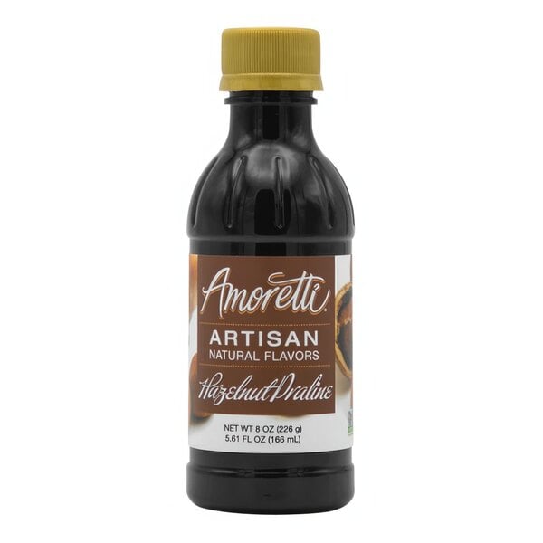 A bottle of Amoretti Hazelnut Praline Artisan Natural Flavor Paste with a brown label and a yellow cap.